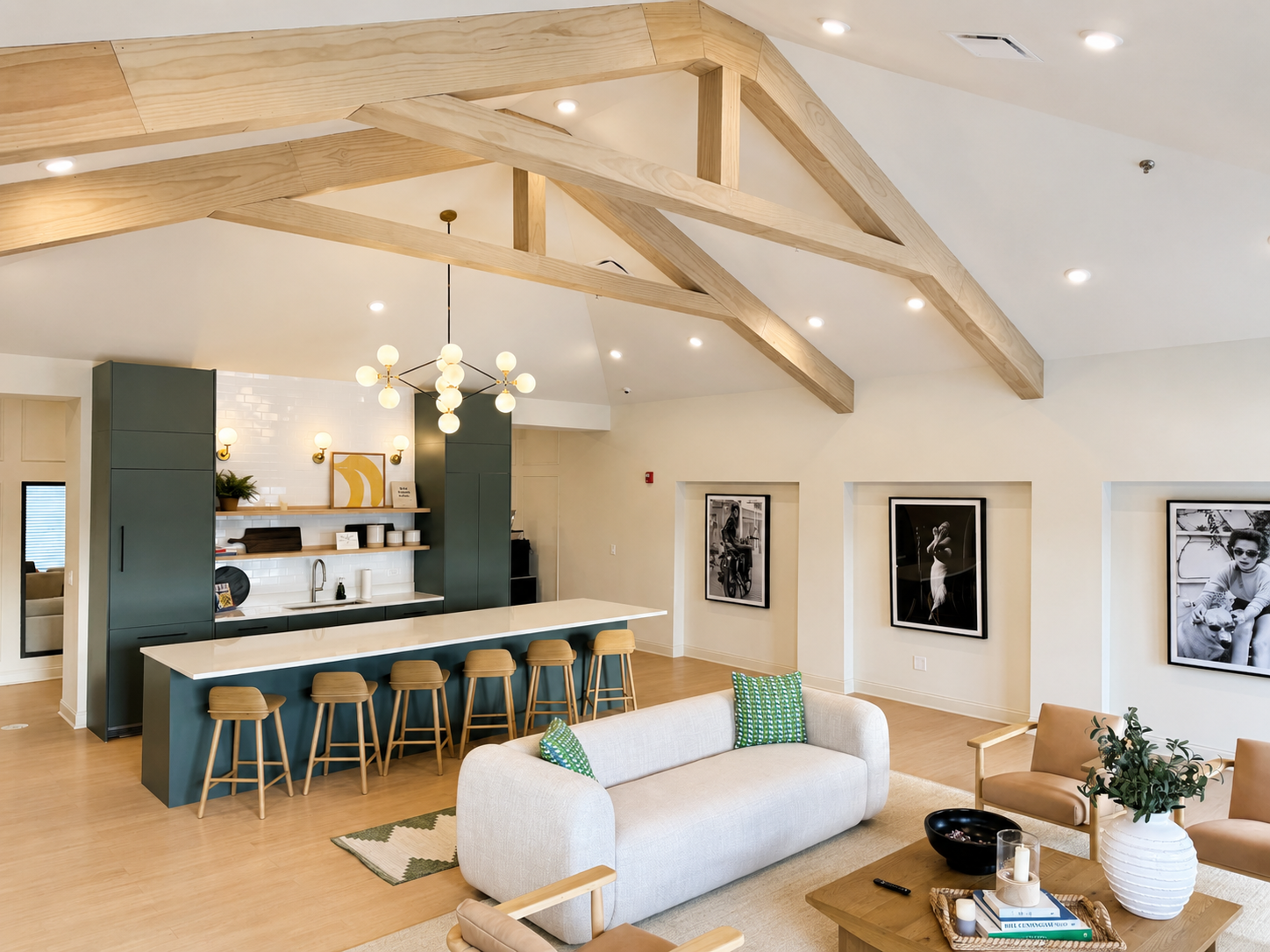 Open-concept kitchen and living area with vaulted beams and a breakfast bar at Home at Ashcroft