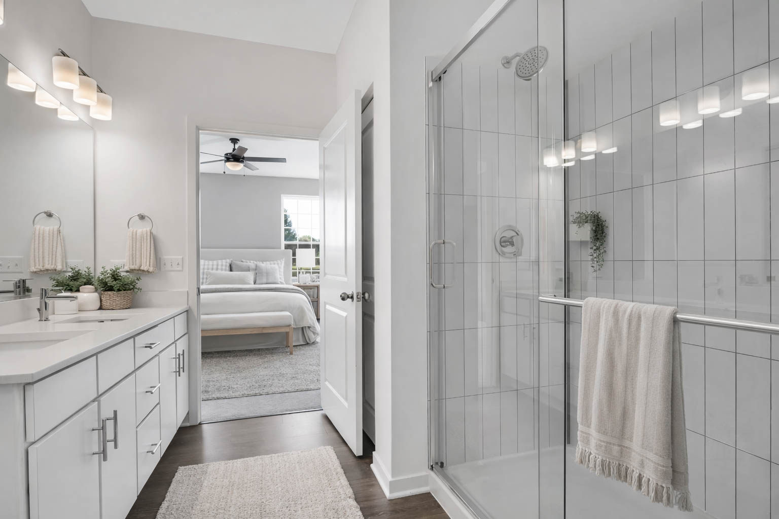 Bathroom with a walk-in glass shower and a double vanity at Home at Ashcroft